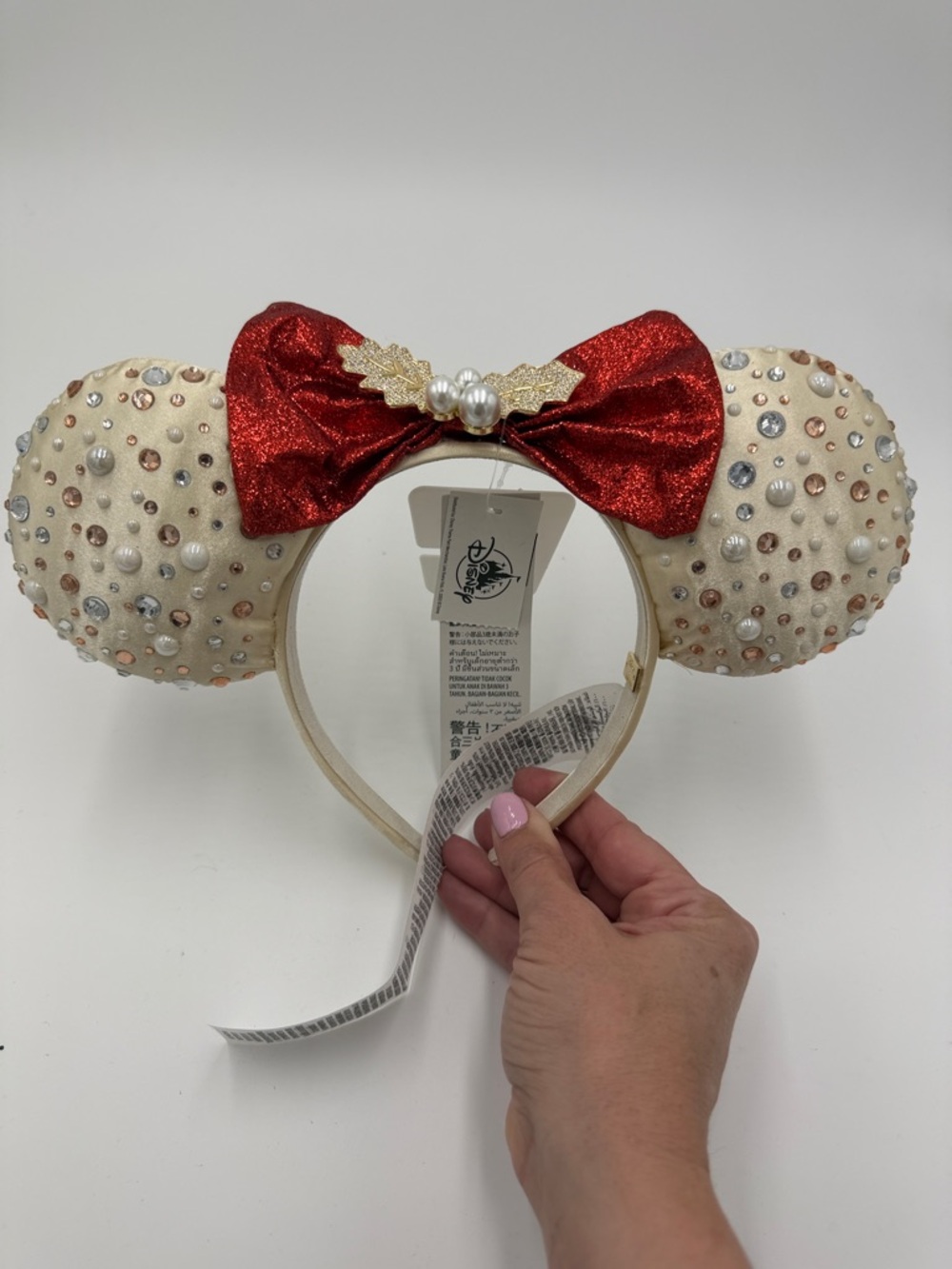Disney Cream Sequin Pearl Minnie Ears with Red Glitter Bow